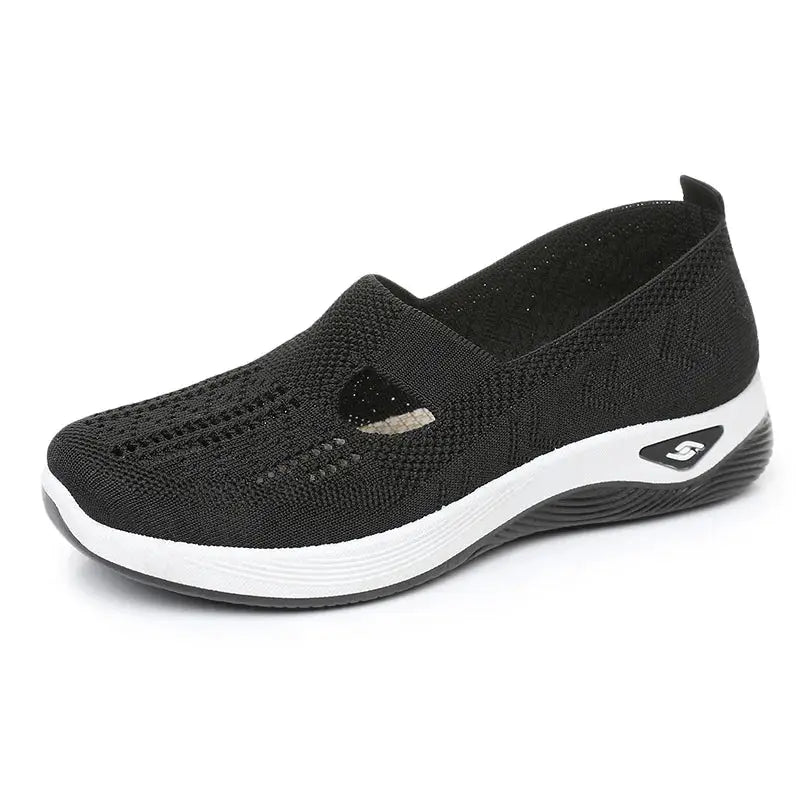 Women's casual mesh sneakers with cut-out T-strap and cushioned wedge sole, black by Simples Market.