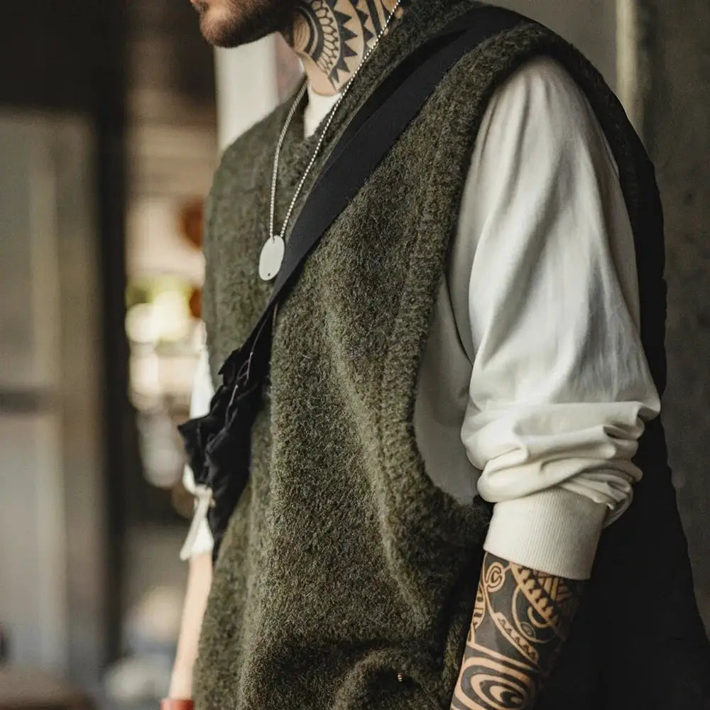Maden Retro wool-blend knitted V-neck vest for layering; olive green sleeveless waistcoat over white shirt.