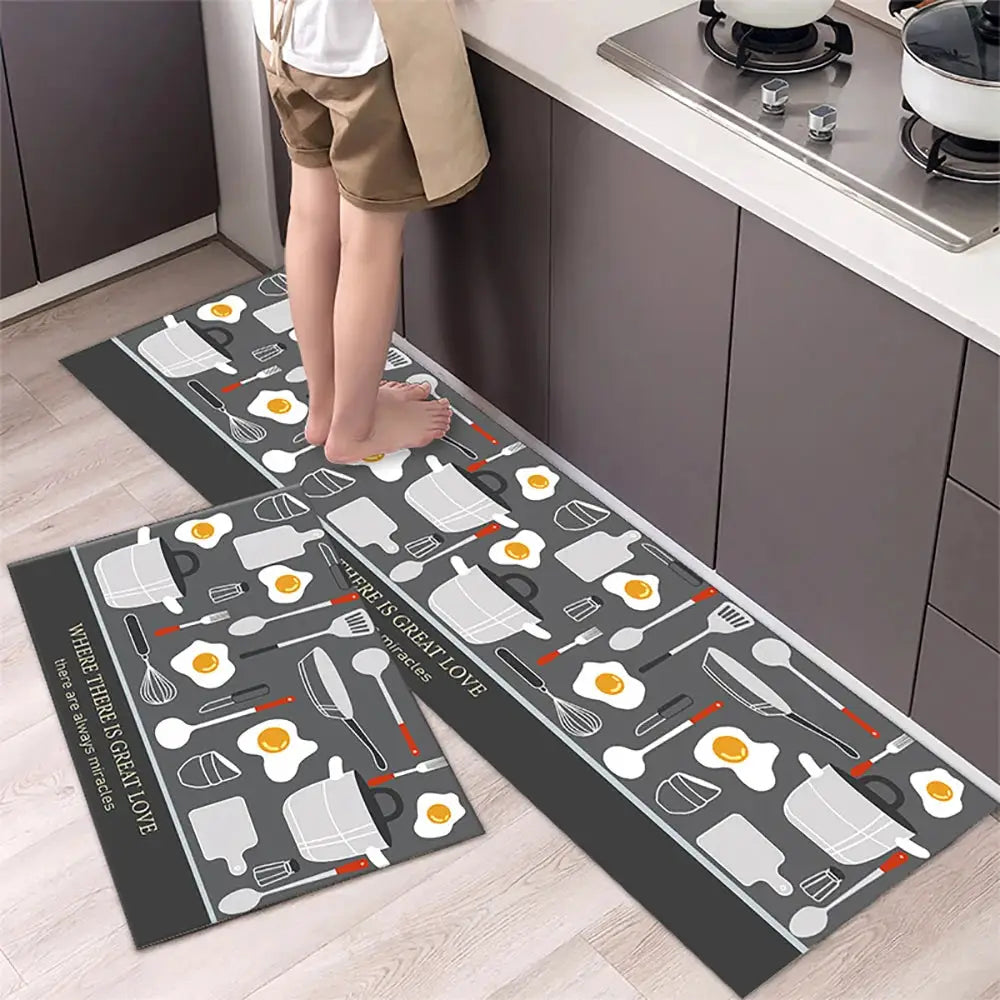Non-slip kitchen runner mats by Simples Market in gray with utensil and egg print, two-piece set