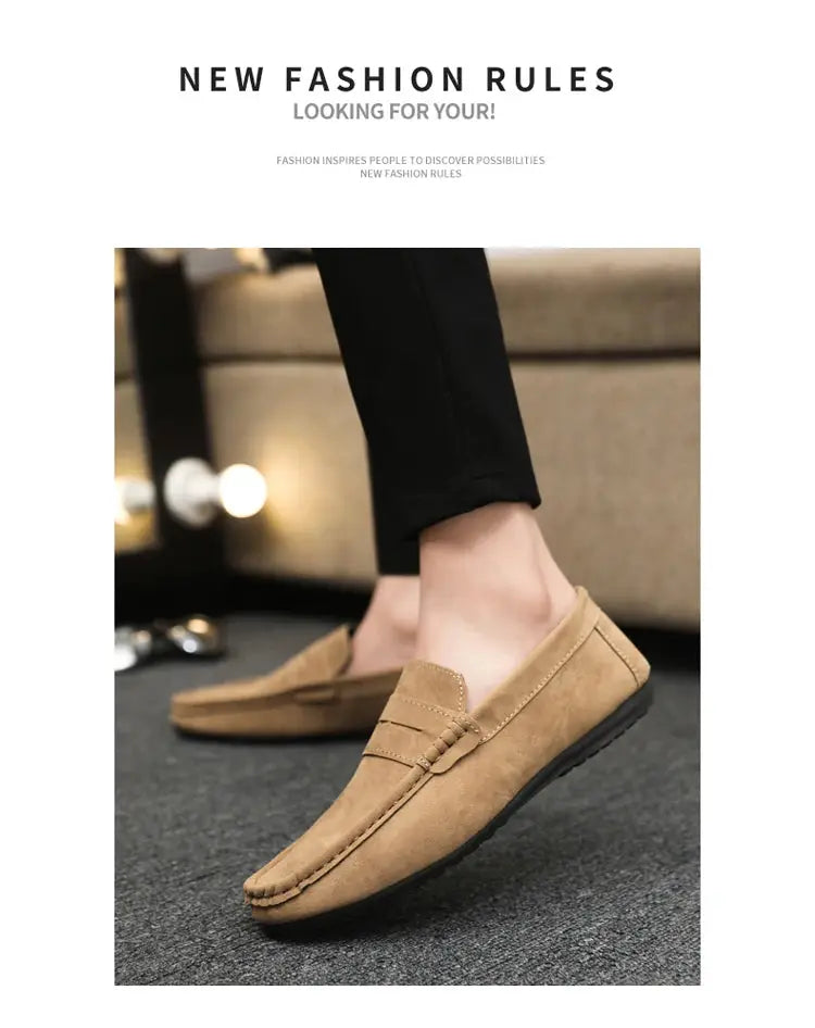 Pair of tan suede driving loafers with black soles for men