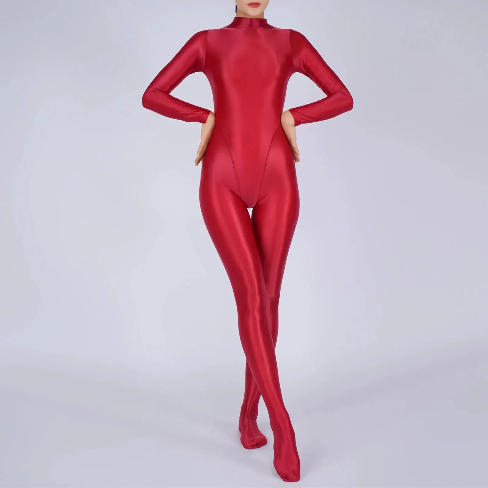 Women's red metallic full-body jumpsuit with long sleeves and footed legs, athletic bodysuit