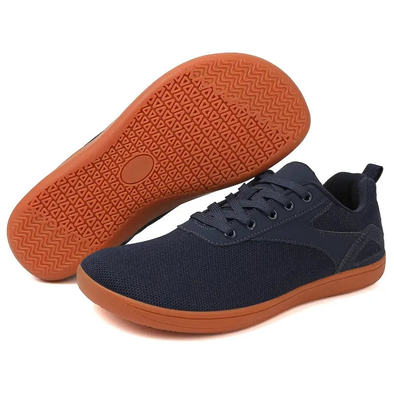Wide-toed casual sports shoes with navy blue mesh upper and orange sole