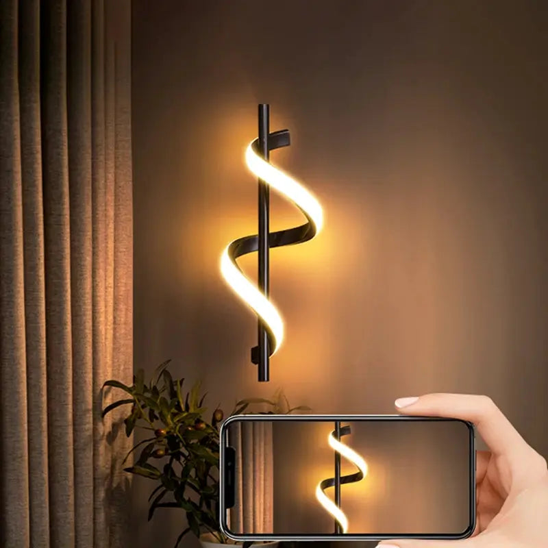 Lustre LED pendant light by Simples Market, black spiral wall-mount with warm glow