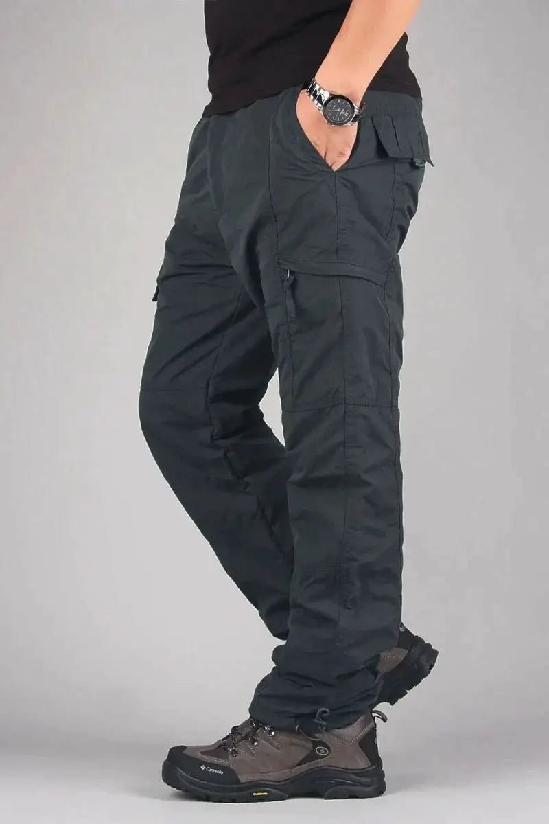 Men's cargo hiking pants, dark olive with multiple pockets and rugged outdoor styling
