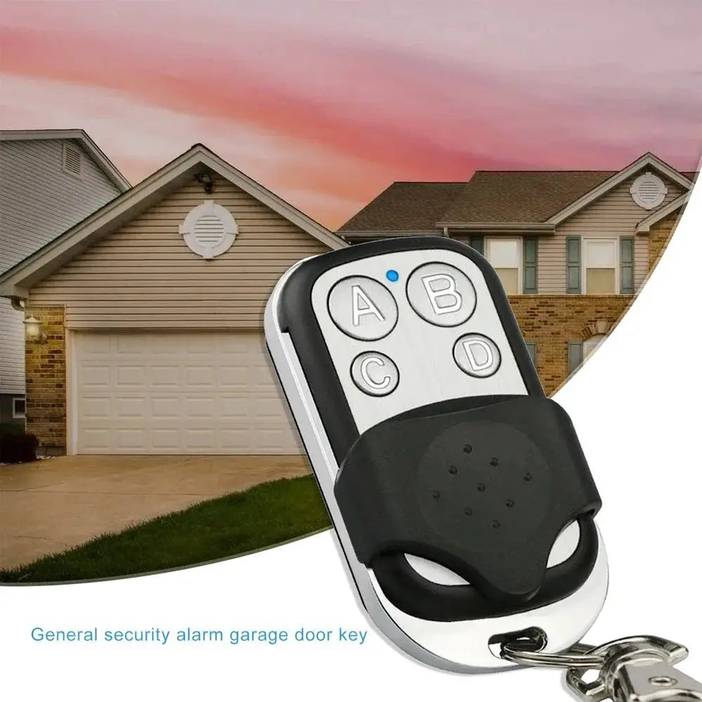 Universal 4-Button Garage Door Opener Remote by Simples Market, silver front with black grip and keychain