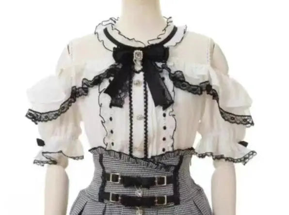 Girls lolita blouse with white sheer fabric, black lace trim, and bow detail