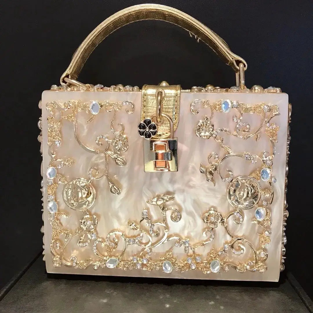 Crystal box-style evening bag with gold floral filigree and crystals