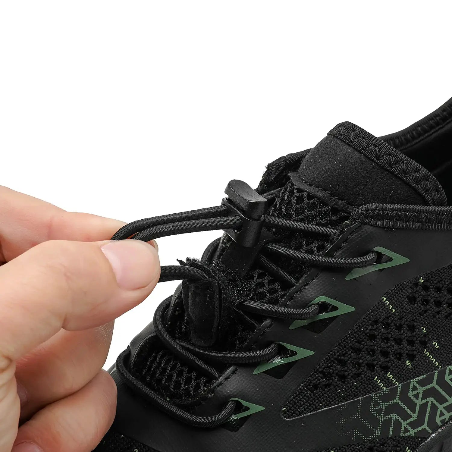 Men's trail running shoe with black knit upper and green accents; close-up of lace lock toggle