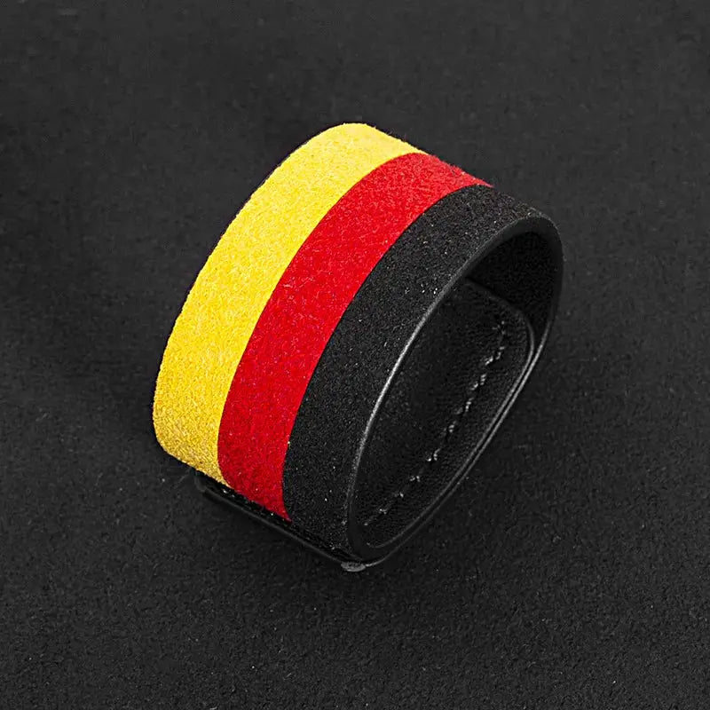 Steering wheel center stripe accessory in suede with yellow, red, and black bands