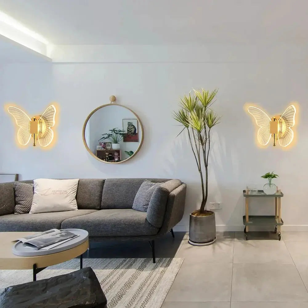 Pair of butterfly LED wall lamps by Simples Market; modern metal and acrylic sconces with warm yellow light