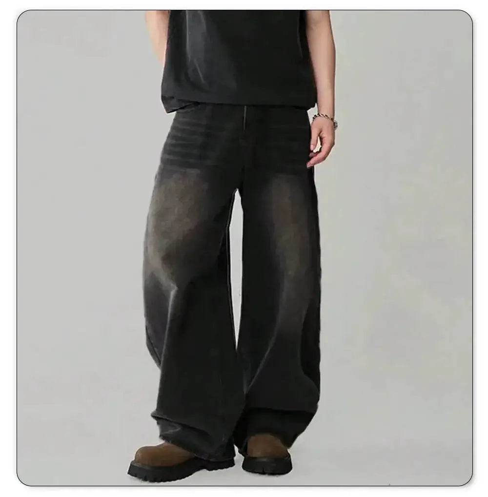 Men's baggy wide-leg denim jeans in dark wash with subtle fading for casual streetwear