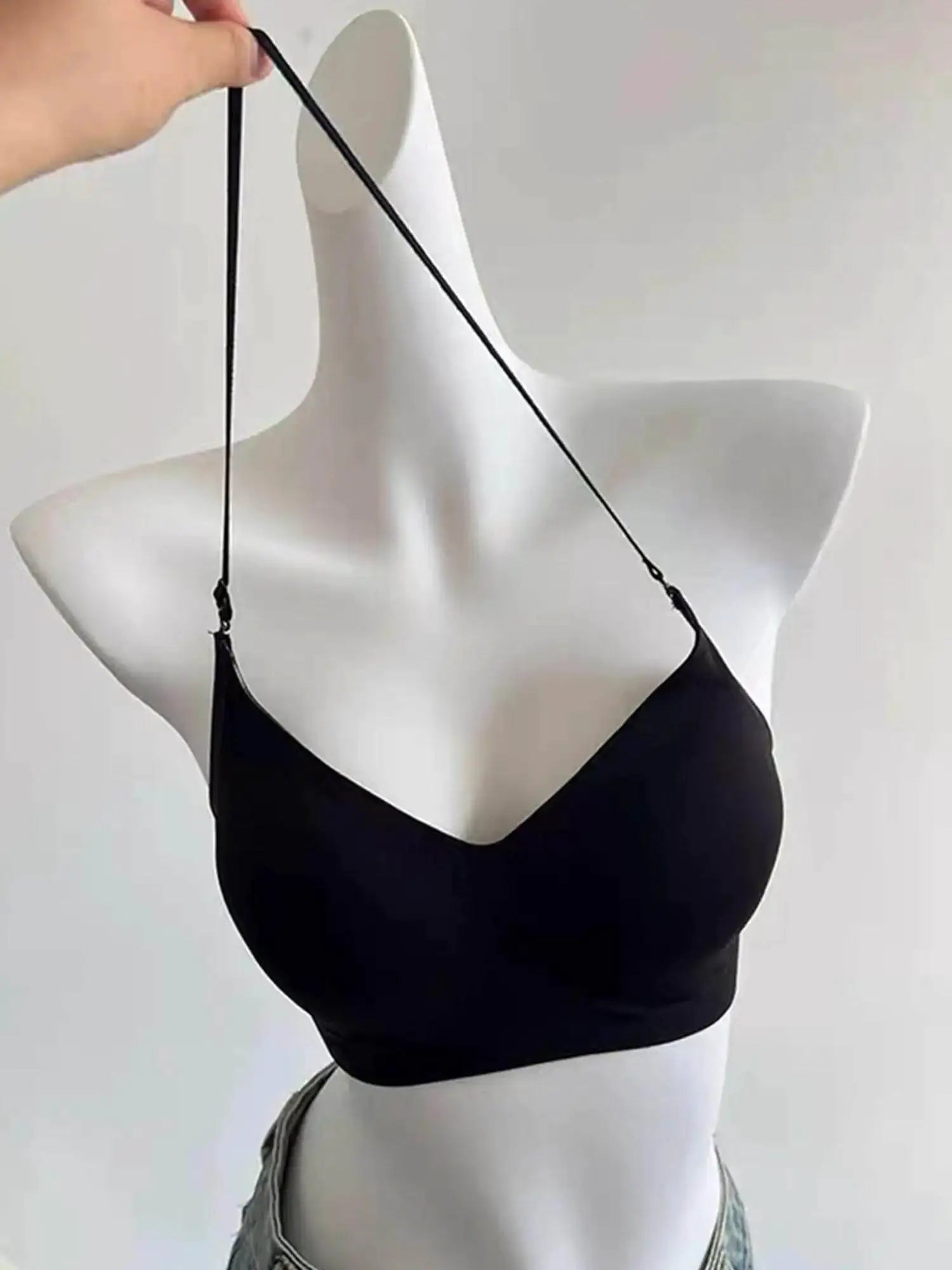 Simples Market backless halter bralette in black, seamless with multiway cross-back design.
