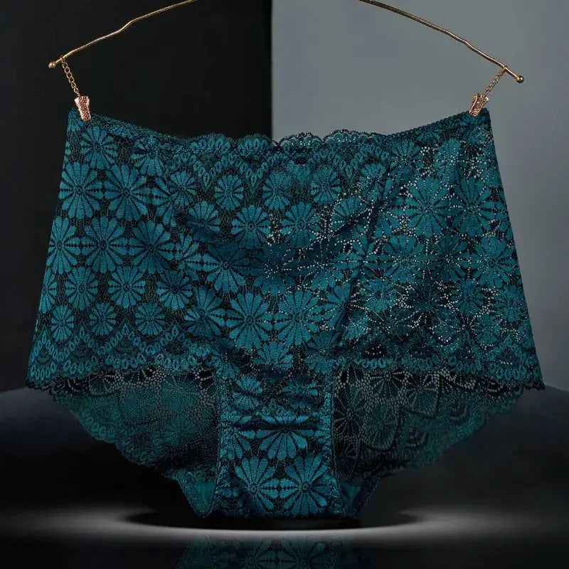 Women's teal floral lace high-waisted panties hanging on a hanger