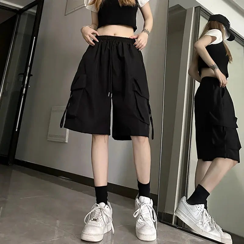 ZOKI women's black high-waist cargo shorts with large pockets, American style streetwear wide-leg.