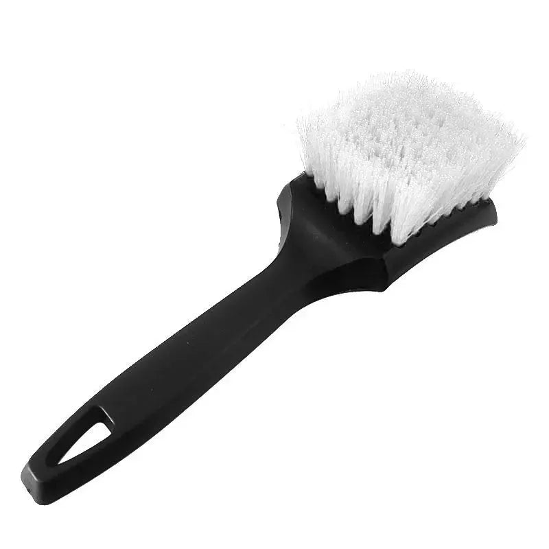 Simples Market car tire rim brush with black handle and white stiff bristles.