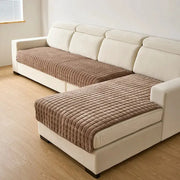Flannel sofa seat cushions by Simples Market; two brown quilted mats on a beige sectional.