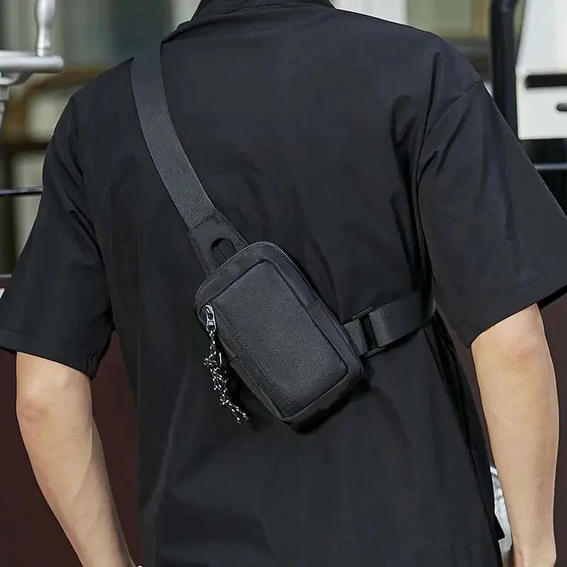 Crossbody bag for men, black mini chest bag with adjustable diagonal strap and zipper.