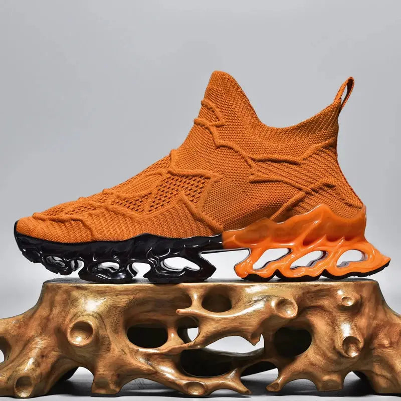Men's orange knit sneaker with a sculpted black/orange sole and breathable sock-like upper.