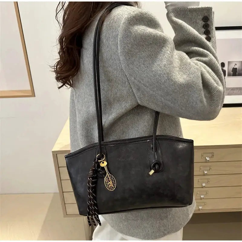 European American Retro Tote Bag by Simples Market, black faux leather shoulder handbag with tassel pendant