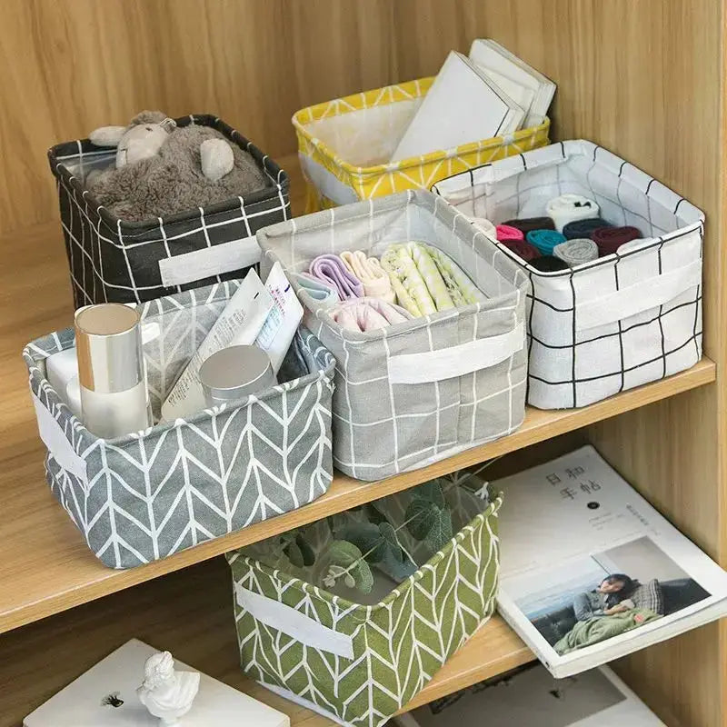 Six linen storage baskets in gray, white, yellow, and green patterns for desk and home organization