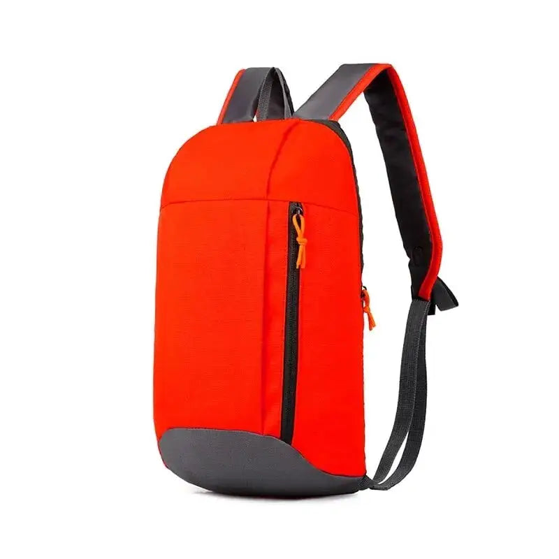 Men's outdoor lightweight small sports backpack by Simples Market in bright orange with gray bottom.