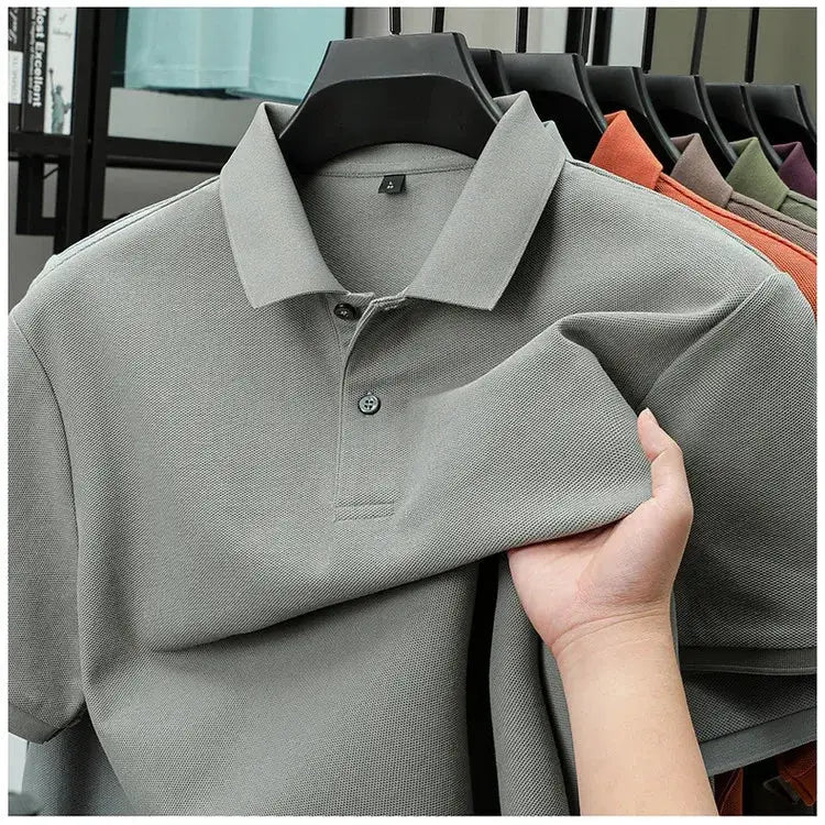 Men's 100% cotton polo shirt by Simples Market in gray with a silk-like finish; breathable casual golf polo on hanger.