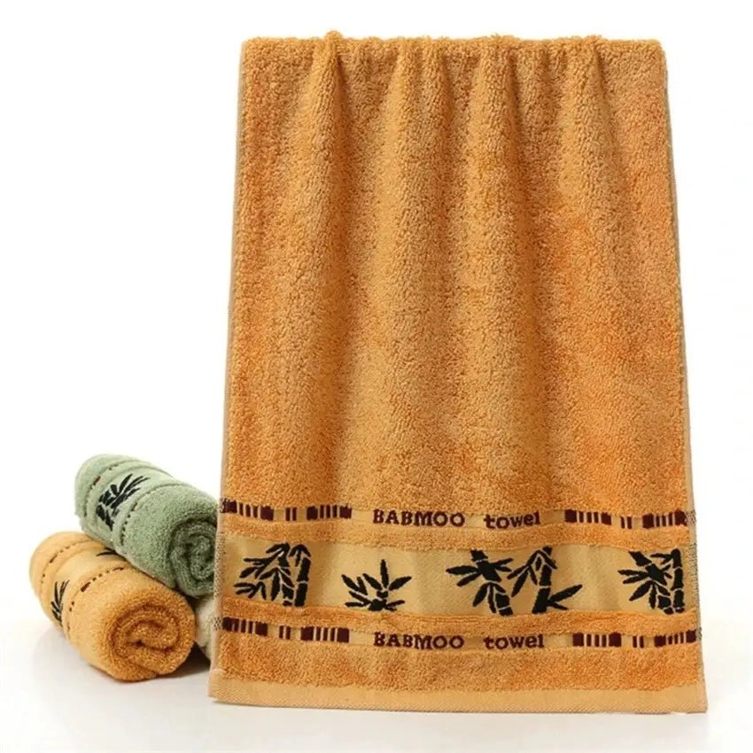 Set of 2 bamboo fiber towels in orange with bamboo-band trim; bath towel 70x140cm and hand towel 34x74cm