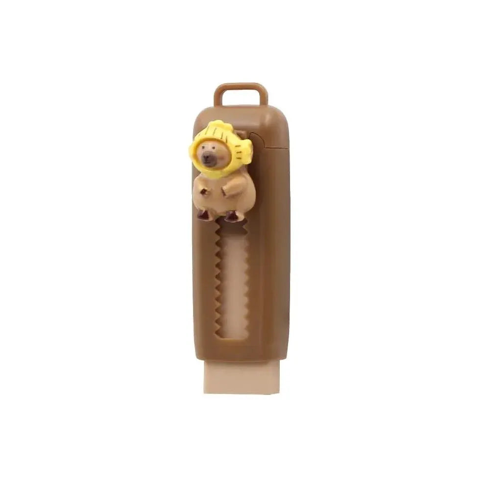 Capybara eraser retractable in brown with yellow capybara figurine on top