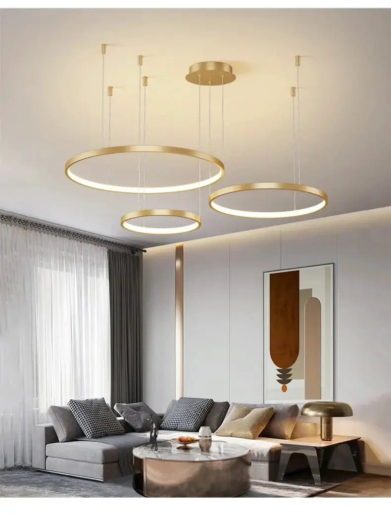 Ring pendant lights in gold, three circular LED chandeliers for living room.
