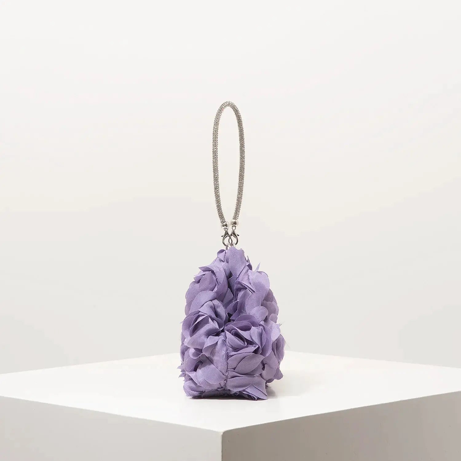 Mini purse with lavender fabric flower rosettes and a silver chain handle