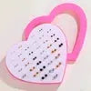 Resin stud earrings set in a pink heart box; 36-pair lot with snowflake, cat, and butterfly designs