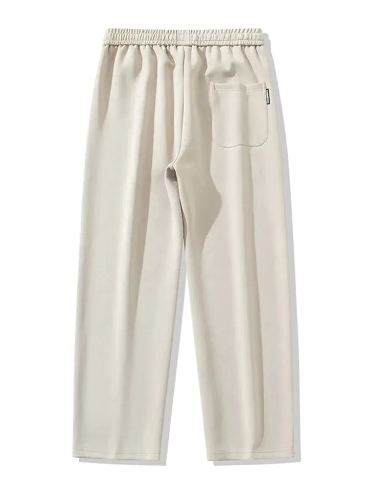 Men's beige cotton track pants by Simples Market, elastic waistband, single back pocket, wide-leg casual trousers.