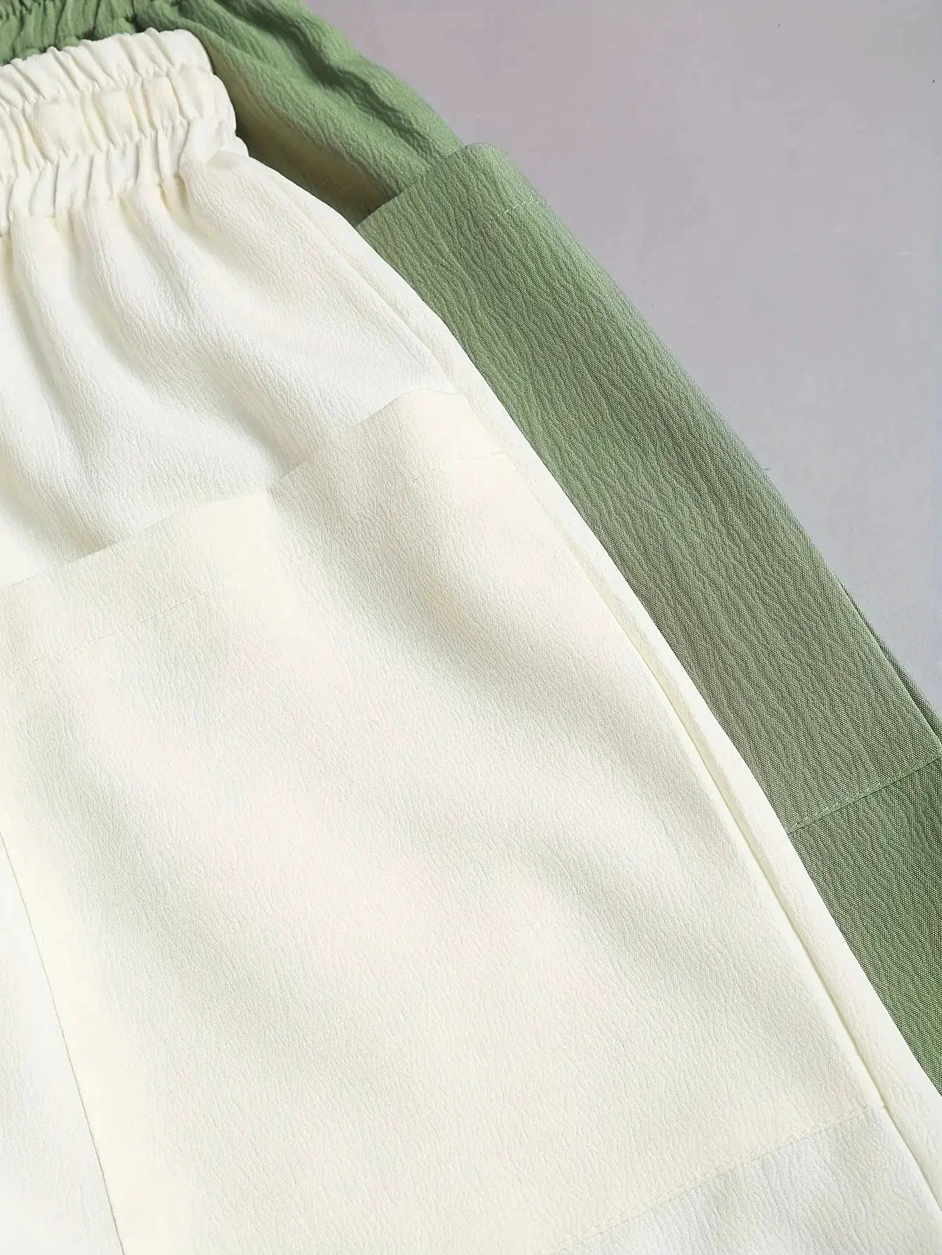 2-piece women's shorts set in white and sage green with pockets and drawstring waist