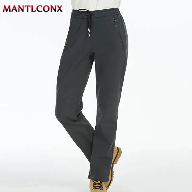Simples Market breathable men's jogger pants with elastic waist, zip pockets, dark gray, MANTLCONX logo