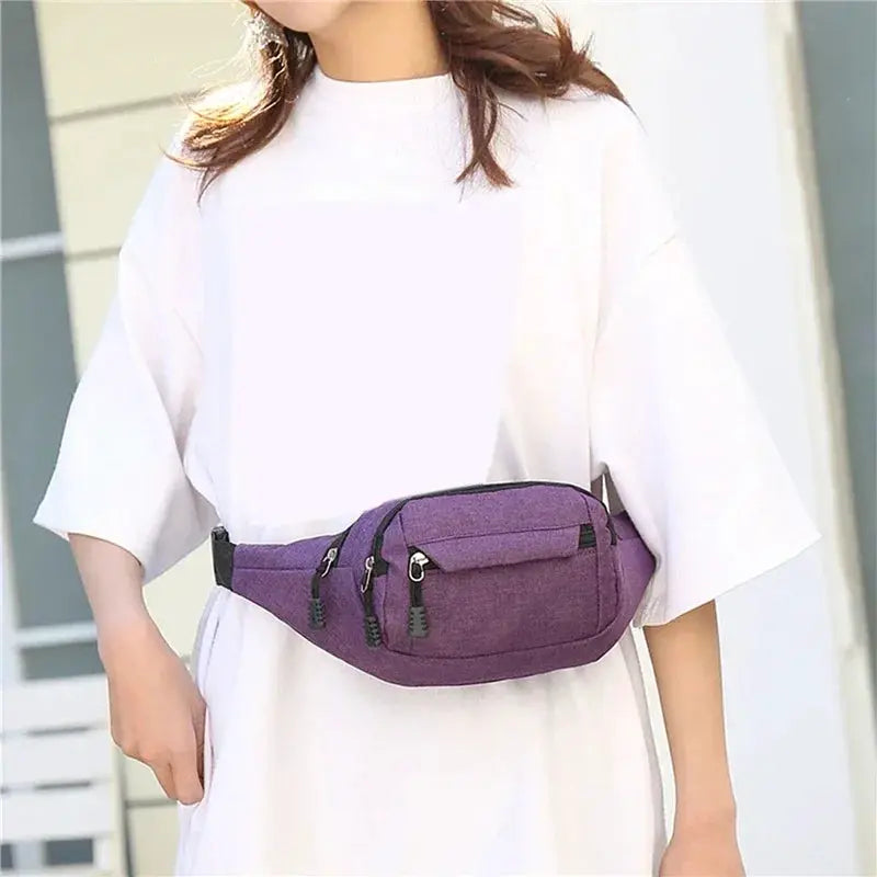 Waist bag by Simples Market, purple unisex belt bag with multiple zipped pockets.