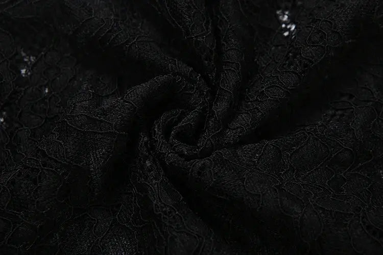 Jacquard fabric in black with textured floral pattern close-up