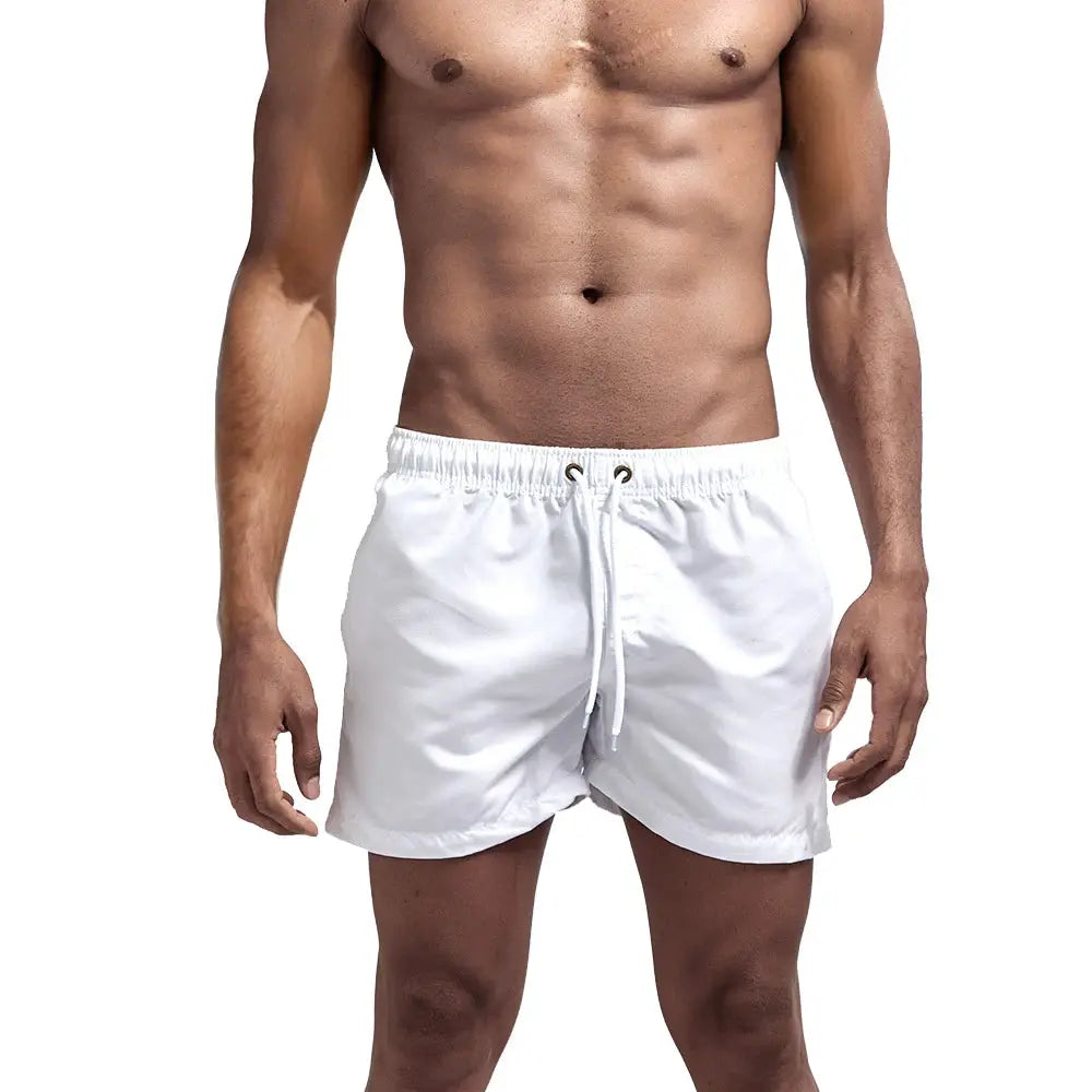 Men's white quick-dry swim shorts with drawstring pockets