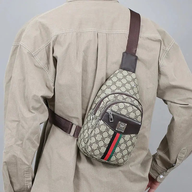 Men's beige canvas crossbody messenger bag with brown trim and green-red-green stripe, front zip pocket