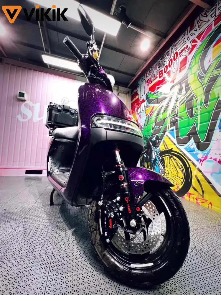 Car stickers PET forged carbon fiber color-change vinyl film on a purple motorcycle; VIKIK logo visible in studio.