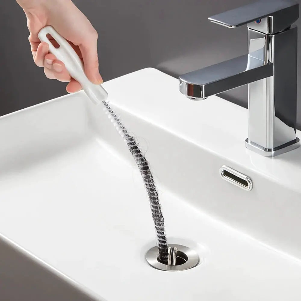 Pipe dredging brush by Simples Market with white handle and flexible metal bristles for sink drain