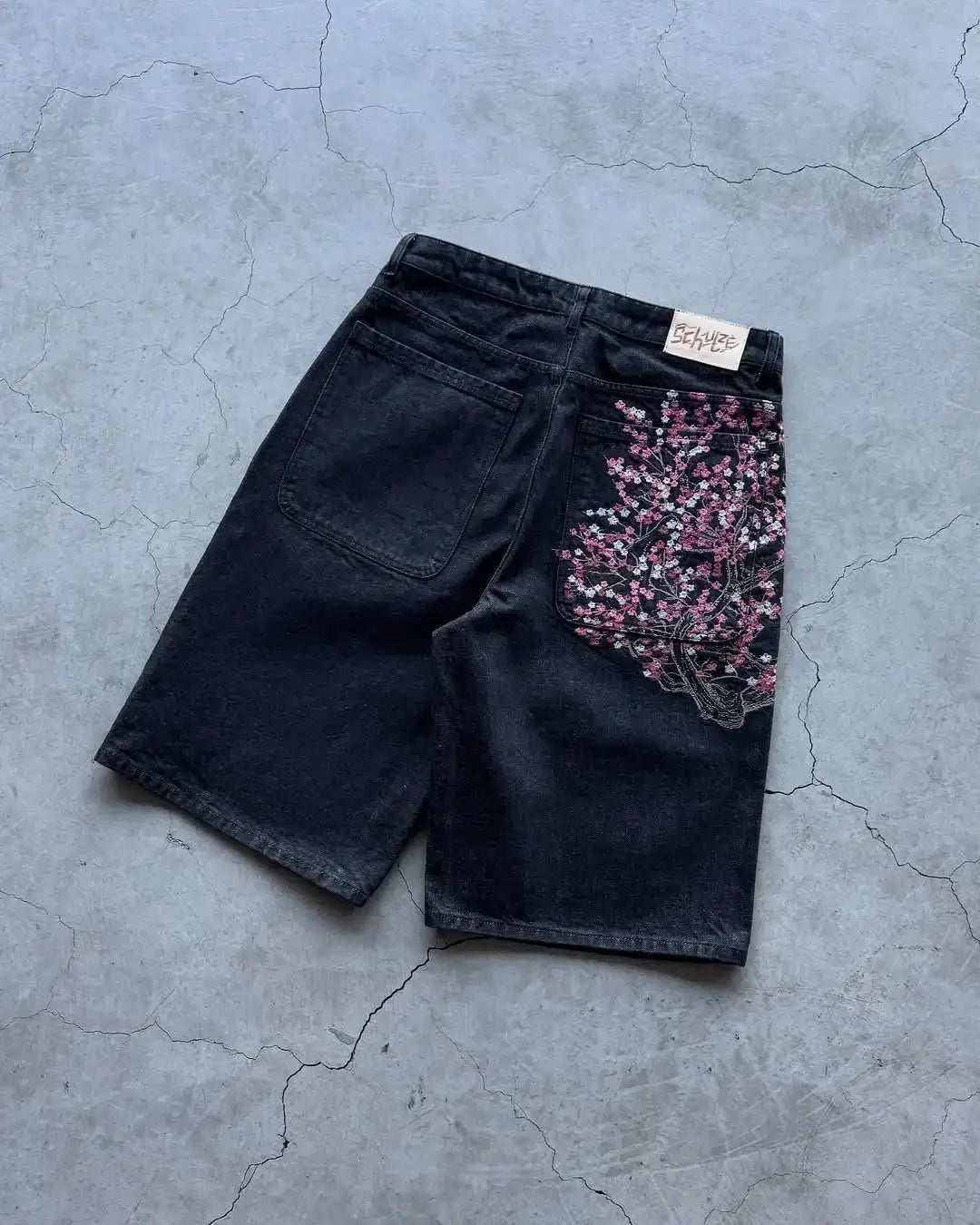 Denim shorts by Simples Market with cherry blossom embroidery on the right back pocket, dark wash, baggy wide-leg