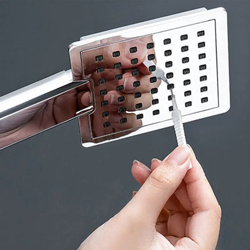 Shower cleaning brush with micro nylon head for nozzle cleaning on a chrome perforated plate