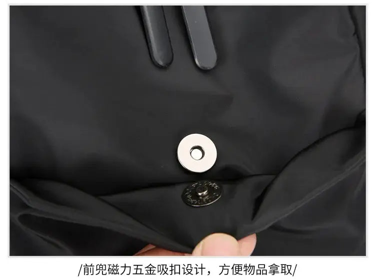 Men's chest bag Simples Market, large black canvas crossbody with dual zipper pulls and magnetic snap closure.