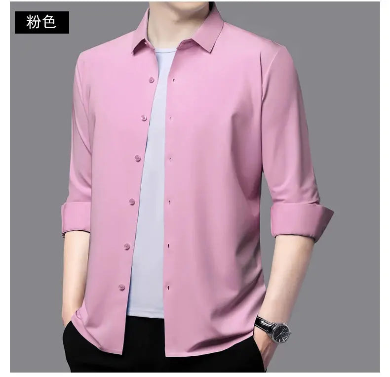 Premium Men's Ultra-Stretch Shirt in pink with rolled cuffs, worn over a white tee.