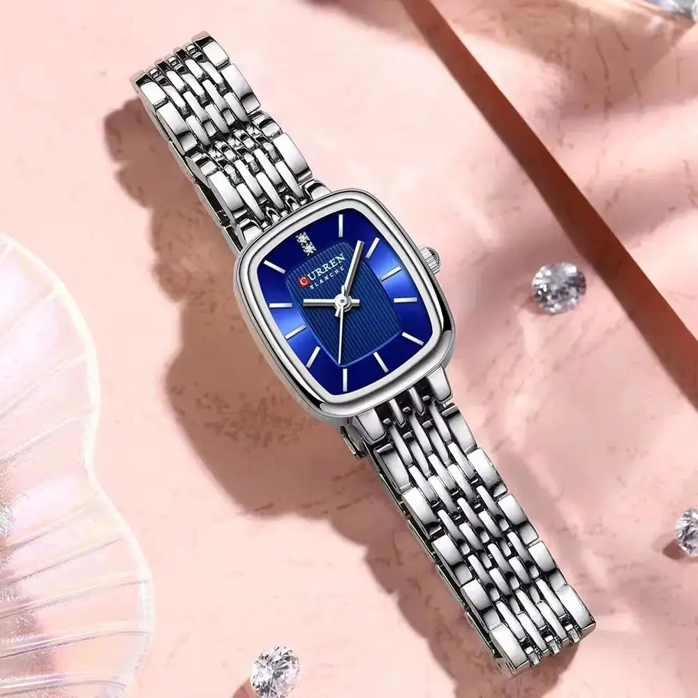 CURRN 9093 women's quartz watch with blue dial, silver steel bracelet, diamond accents