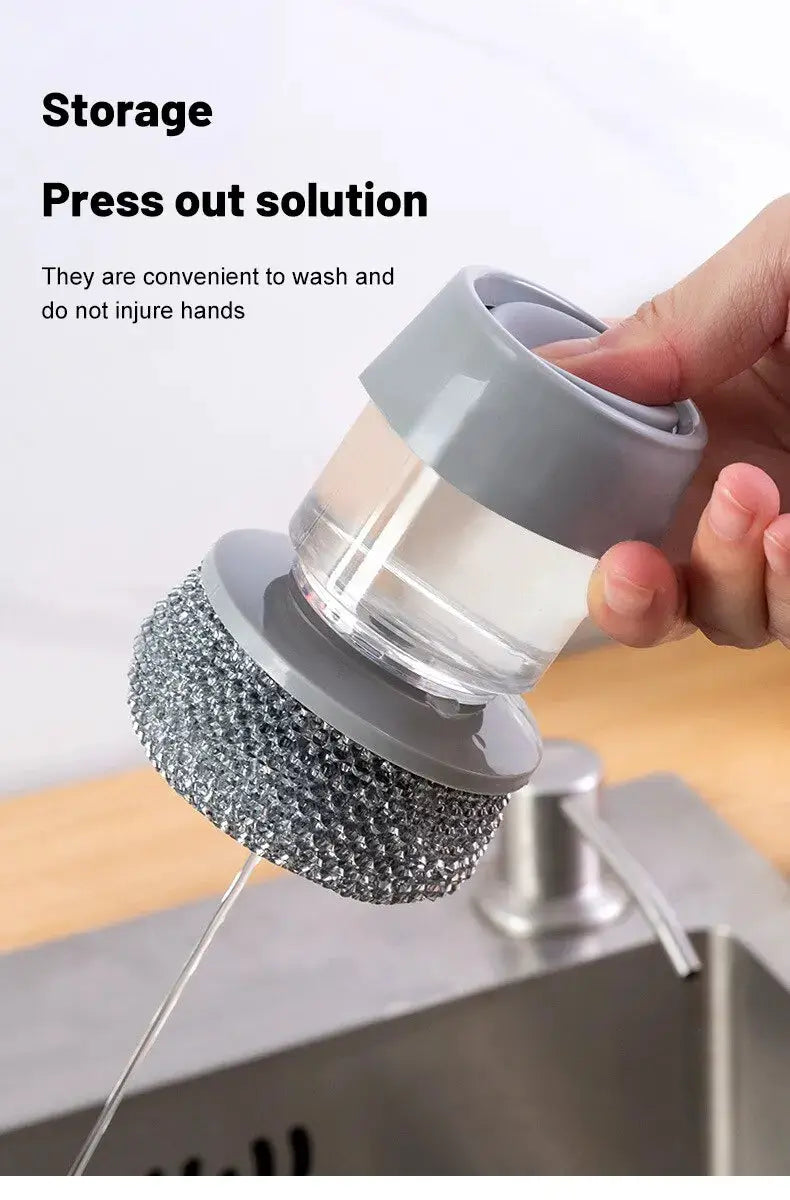 Simples Market portable soap-dispensing dishwashing brush with clear reservoir and gray grip.
