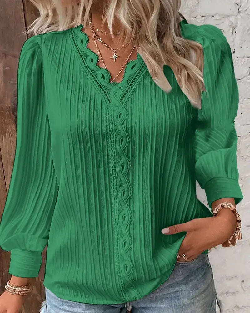 Green lace-front blouse with V-neck long sleeves and looped front trim