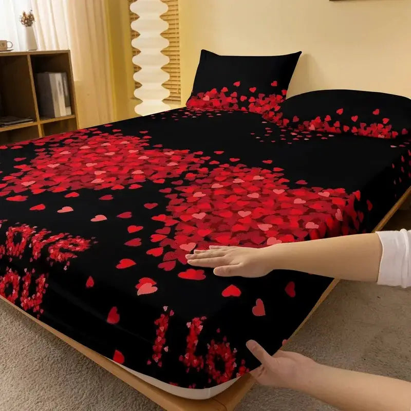 Bedsheet with black background and scattered red heart pattern on a bed in a bedroom.