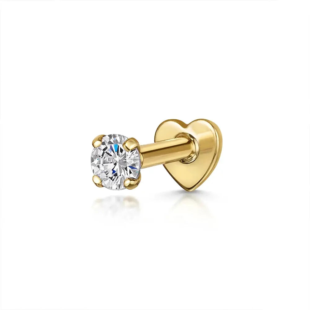 AIDE heart stud earring with round clear zircon in a gold-tone metal setting.
