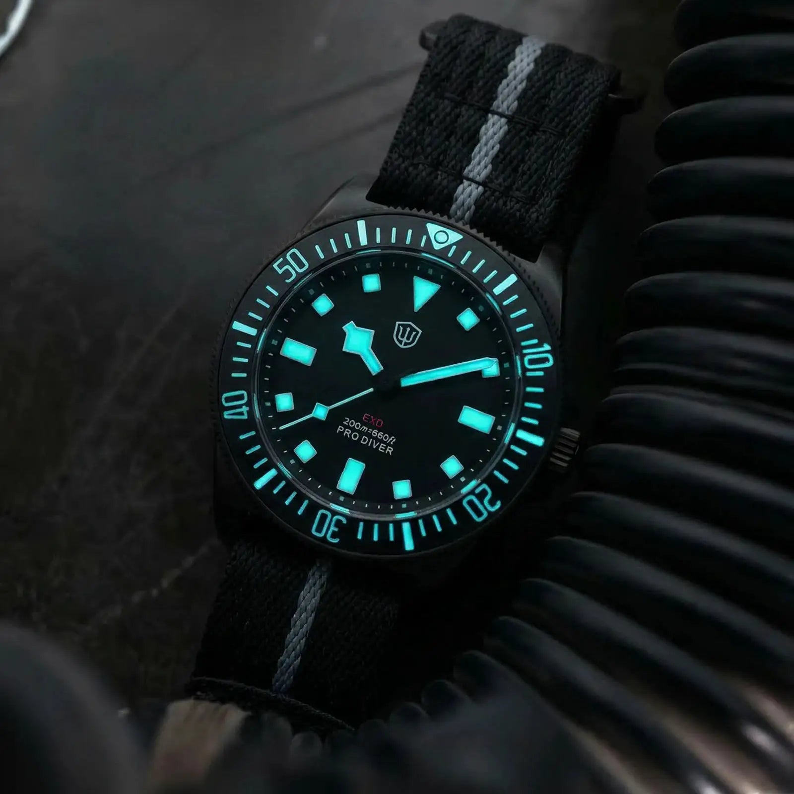 Watchdives EXD 40mm dive watch by Simples Market with turquoise luminescent dial and black nylon strap